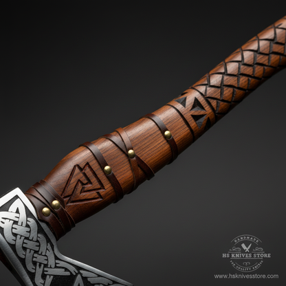 Close-up macro of carved rosewood handle showing deep diamond crosshatch pattern and Valknut Odin knot symbol with leather collar and brass rivets