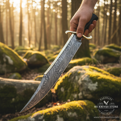 Hunter hand gripping black hardwood handle Damascus steel large Bowie knife in action pose outdoor forest golden sunlight
