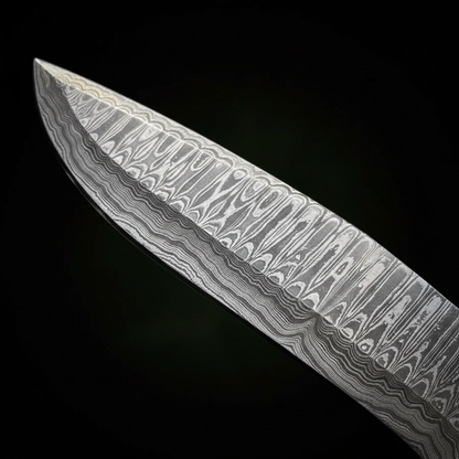 Damascus steel blade pattern close-up on Bowie knife layered twist pattern etched steel