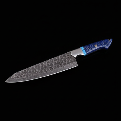 Handmade Damascus chef knife blue honeycomb handle black studio left facing mirror shot