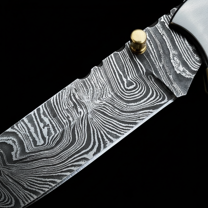 Ladder Damascus steel blade pattern macro close-up on folding bull cutter knife