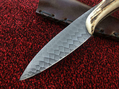 Custom hunting knife showing blade craftsmanship detail