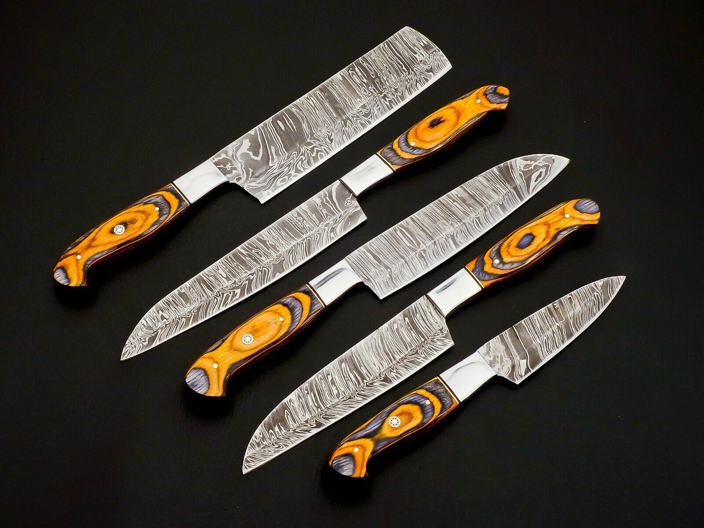 Handmade Damascus kitchen knives set razor sharp blades close-up