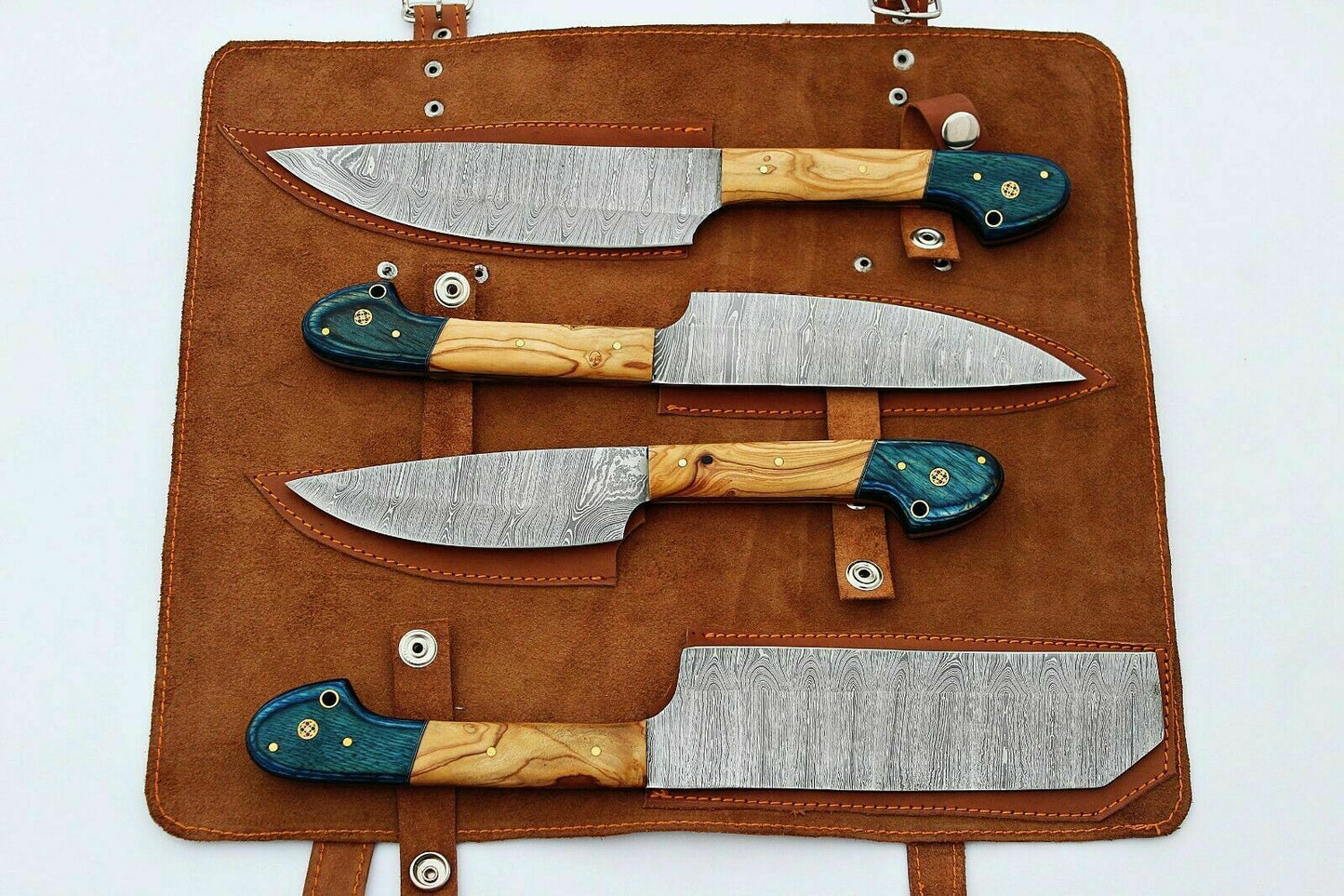 Complete Damascus kitchen knife set showing multiple sizes and professional chef knives collection